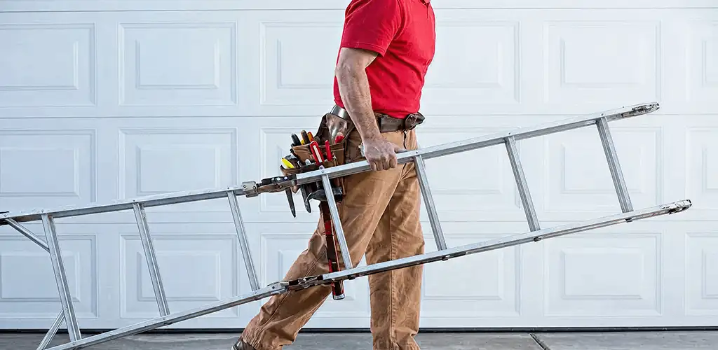 Garage door repair technician arriving with tools and ladder in Grand Rapids, MI